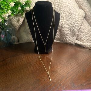 Gold-tone double strand necklace with skinny bar pendants